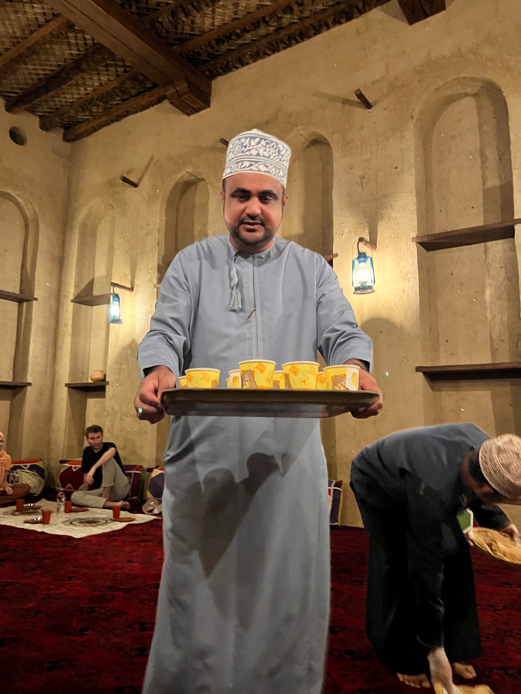 Gentleman holding tray of tea